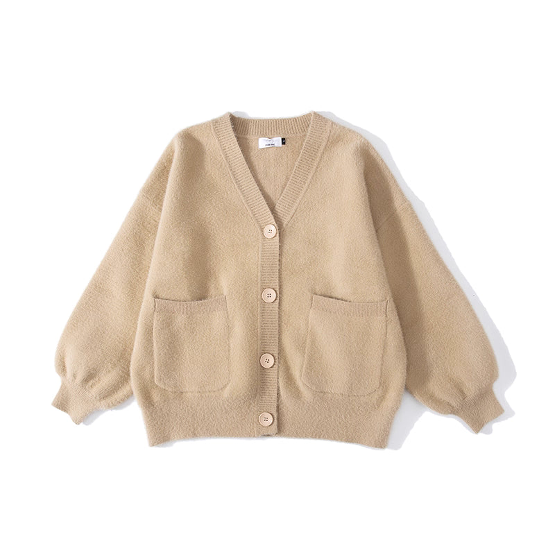 Designed for petite frames, this irresistibly plush cardigan wraps you in a cloud of softness with its fuzzy knit texture and playful pink hue. The cropped silhouette and cozy long sleeves balance warmth with effortless style, while the lightweight construction makes it a versatile layer for crisp days. A sweet yet practical piece that feels like a warm hug on chilly mornings.