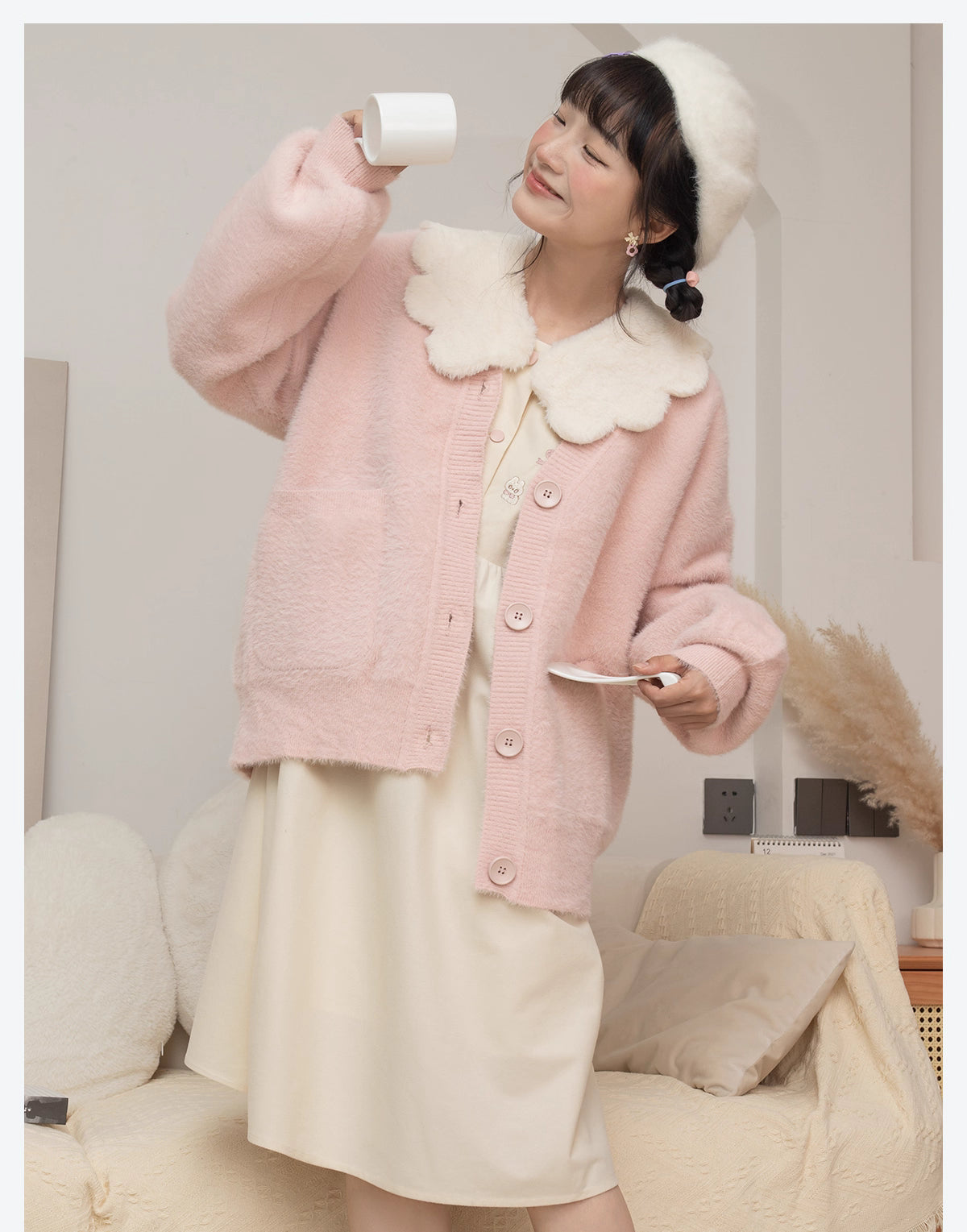 Designed for petite frames, this irresistibly plush cardigan wraps you in a cloud of softness with its fuzzy knit texture and playful pink hue. The cropped silhouette and cozy long sleeves balance warmth with effortless style, while the lightweight construction makes it a versatile layer for crisp days. A sweet yet practical piece that feels like a warm hug on chilly mornings.
