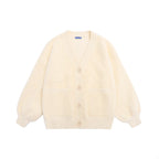 Designed for petite frames, this irresistibly plush cardigan wraps you in a cloud of softness with its fuzzy knit texture and playful pink hue. The cropped silhouette and cozy long sleeves balance warmth with effortless style, while the lightweight construction makes it a versatile layer for crisp days. A sweet yet practical piece that feels like a warm hug on chilly mornings.