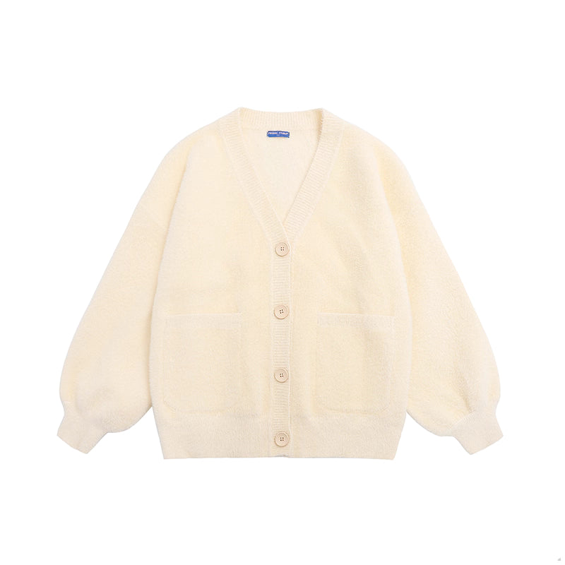 Designed for petite frames, this irresistibly plush cardigan wraps you in a cloud of softness with its fuzzy knit texture and playful pink hue. The cropped silhouette and cozy long sleeves balance warmth with effortless style, while the lightweight construction makes it a versatile layer for crisp days. A sweet yet practical piece that feels like a warm hug on chilly mornings.