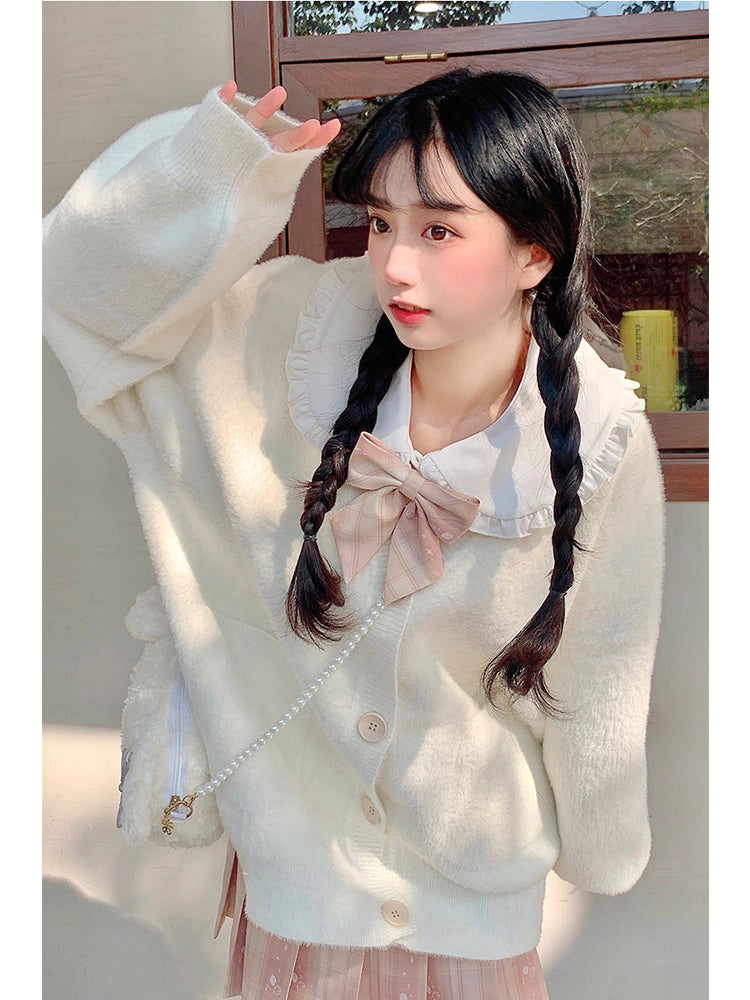 Designed for petite frames, this irresistibly plush cardigan wraps you in a cloud of softness with its fuzzy knit texture and playful pink hue. The cropped silhouette and cozy long sleeves balance warmth with effortless style, while the lightweight construction makes it a versatile layer for crisp days. A sweet yet practical piece that feels like a warm hug on chilly mornings.