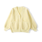 Designed for petite frames, this irresistibly plush cardigan wraps you in a cloud of softness with its fuzzy knit texture and playful pink hue. The cropped silhouette and cozy long sleeves balance warmth with effortless style, while the lightweight construction makes it a versatile layer for crisp days. A sweet yet practical piece that feels like a warm hug on chilly mornings.