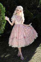 The Black Pink Floral Jacquard Lolita Dress is designed to balance elegance with sweetness. Featuring delicate floral jacquard fabric, soft ruffles, and refined embroidery, it exudes a sense of luxury and charm. The bowknot accents and short sleeves add a playful touch, while the contrasting black and pink tones highlight femininity. Perfect for tea parties, gatherings, or special occasions, this dress embodies the romantic essence of Sweet Lolita fashion.