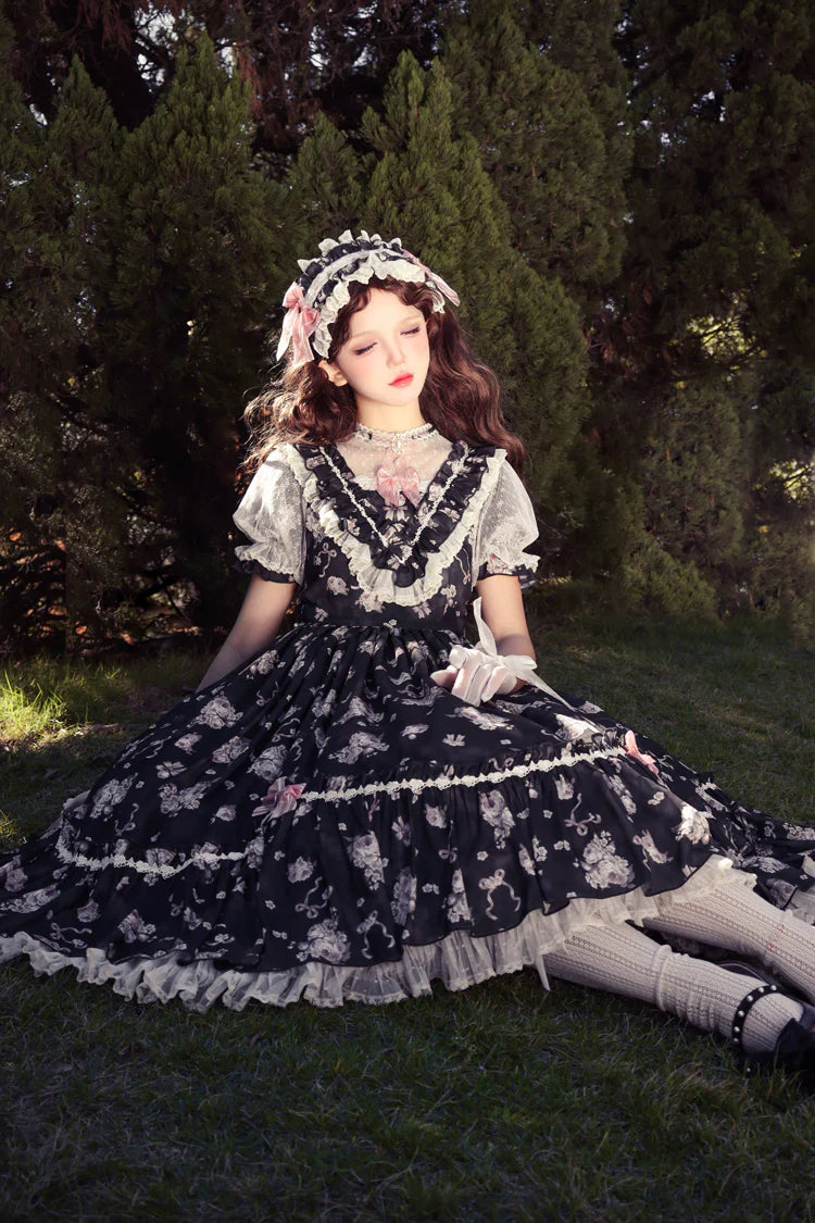 The Black Pink Floral Jacquard Lolita Dress is designed to balance elegance with sweetness. Featuring delicate floral jacquard fabric, soft ruffles, and refined embroidery, it exudes a sense of luxury and charm. The bowknot accents and short sleeves add a playful touch, while the contrasting black and pink tones highlight femininity. Perfect for tea parties, gatherings, or special occasions, this dress embodies the romantic essence of Sweet Lolita fashion.