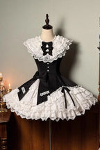 This dress dances between darkness and delight, blending Gothic subtlety with Lolita’s sweet heart. Layer upon layer of lace and ruffles create a dynamic texture, while the asymmetrical hemline adds modern whimsy to classic elegance. The delicate bow accents and sleeveless design offer versatility—perfect for layering or standing alone—inviting the wearer to embrace both mystery and innocence in a single, unforgettable silhouette.