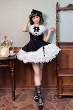 This dress dances between darkness and delight, blending Gothic subtlety with Lolita’s sweet heart. Layer upon layer of lace and ruffles create a dynamic texture, while the asymmetrical hemline adds modern whimsy to classic elegance. The delicate bow accents and sleeveless design offer versatility—perfect for layering or standing alone—inviting the wearer to embrace both mystery and innocence in a single, unforgettable silhouette.