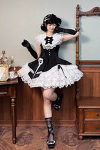 This dress dances between darkness and delight, blending Gothic subtlety with Lolita’s sweet heart. Layer upon layer of lace and ruffles create a dynamic texture, while the asymmetrical hemline adds modern whimsy to classic elegance. The delicate bow accents and sleeveless design offer versatility—perfect for layering or standing alone—inviting the wearer to embrace both mystery and innocence in a single, unforgettable silhouette.
