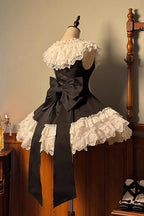 This dress dances between darkness and delight, blending Gothic subtlety with Lolita’s sweet heart. Layer upon layer of lace and ruffles create a dynamic texture, while the asymmetrical hemline adds modern whimsy to classic elegance. The delicate bow accents and sleeveless design offer versatility—perfect for layering or standing alone—inviting the wearer to embrace both mystery and innocence in a single, unforgettable silhouette.