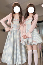 The Blue Plaid JSK Long Dress captures the timeless charm of Sweet Lolita fashion with a touch of classic vintage style. Designed in a sleeveless cut, it features a soft plaid print enhanced with delicate bow accents for added sweetness. The long silhouette creates an elegant flow, balancing playfulness with refinement. Perfect for tea parties, casual outings, or special gatherings, this dress reflects both comfort and the romantic essence of Lolita fashion.