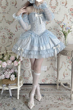 Inspired by the serene beauty of a summer sky meeting the sea, this dress captures the essence of effortless elegance. The strapless halter neckline offers a modern yet romantic silhouette, while layered ruffles and delicate bows create movement and playfulness. Crafted in a soothing blue hue, it blends sweetness with sophistication—perfect for the dreamer who finds magic in both sunlight and starlight.