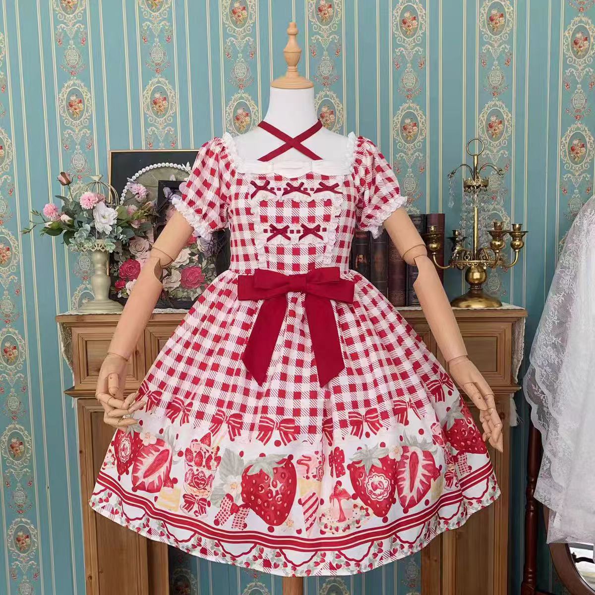 This Cute Black Red Plaid Strawberry Lolita Princess Dress captures the charm of cottage-inspired sweetness. Designed in a plus size friendly cut, it features playful plaid in contrasting black and red tones, adorned with delicate strawberry motifs for a fresh countryside feel. The princess silhouette enhances elegance, while ruffles and bowknot details add girlish charm. Perfect for daily wear, tea parties, or seasonal outings, this dress blends comfort, sweetness, and rustic romance.