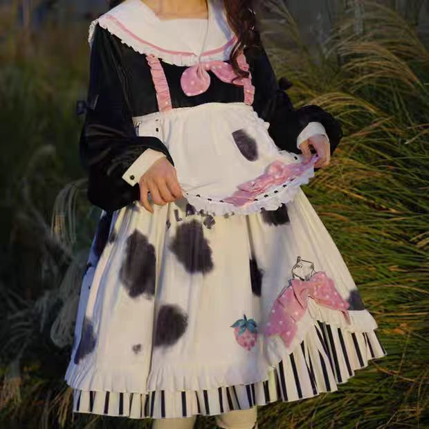 The Cow Print Sweet Lolita Dress combines playful charm with classic elegance. Featuring a doll collar and lantern sleeves, it creates a vintage-inspired silhouette, while the ruffled details and bowknot accents add sweetness. The unique cow print stitching introduces a fun, eye-catching twist that balances cuteness with individuality. Perfect for casual outings, themed events, or tea parties, this dress reflects the whimsical, versatile spirit of Lolita fashion.