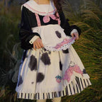 The Cow Print Sweet Lolita Dress combines playful charm with classic elegance. Featuring a doll collar and lantern sleeves, it creates a vintage-inspired silhouette, while the ruffled details and bowknot accents add sweetness. The unique cow print stitching introduces a fun, eye-catching twist that balances cuteness with individuality. Perfect for casual outings, themed events, or tea parties, this dress reflects the whimsical, versatile spirit of Lolita fashion.