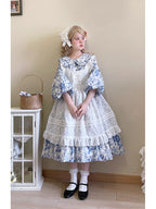 Design Concept:
This Sweet Lolita dress features a delicate white floral overlay with a layered apron-style design, crafted for a soft and elegant silhouette. The mid-length cut and tie-up details at the waist create a flattering fit while maintaining a charming, playful aesthetic. Perfect for daily wear, tea parties, or casual Lolita gatherings, this dress combines classic Lolita sweetness with versatile everyday style.