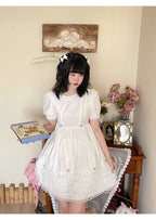 Design Concept:
This Sweet Lolita dress in pure white features delicate lace detailing along the hem and bodice, complemented by a tie-waist design that enhances a flattering silhouette. The puff sleeves add a charming, doll-like touch, creating a playful yet elegant look. Perfect for daily wear, tea parties, or casual Lolita gatherings, this dress brings a soft and feminine aesthetic to any occasion.