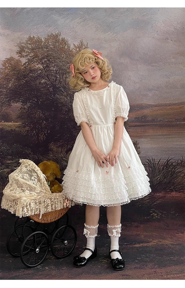 Design Concept:
This Sweet Lolita dress in pure white features delicate lace detailing along the hem and bodice, complemented by a tie-waist design that enhances a flattering silhouette. The puff sleeves add a charming, doll-like touch, creating a playful yet elegant look. Perfect for daily wear, tea parties, or casual Lolita gatherings, this dress brings a soft and feminine aesthetic to any occasion.
