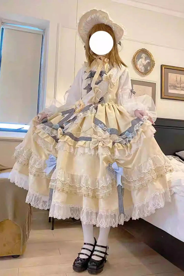 "Inspired by the opulence of royal courts and the delicate beauty of gilded artistry, this dress transforms classic Lolita elegance into a vision of luxury. The gold-toned palette evokes a sense of grandeur, while intricate lace and cascading ruffles reflect both tradition and fantasy."