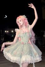Crafted for the dreamer who dwells in enchanted forests, this Lolita dress embodies a whimsical fairy tale. The lush green floral print captures a secret garden in eternal bloom, while delicate lace and soft ruffles mimic dewy foliage and petals. A signature bow adds a touch of playful elegance. We designed this dress to be a wearable fantasy, empowering you to express your most magical and authentic self. Every stitch is an invitation to embrace wonder.