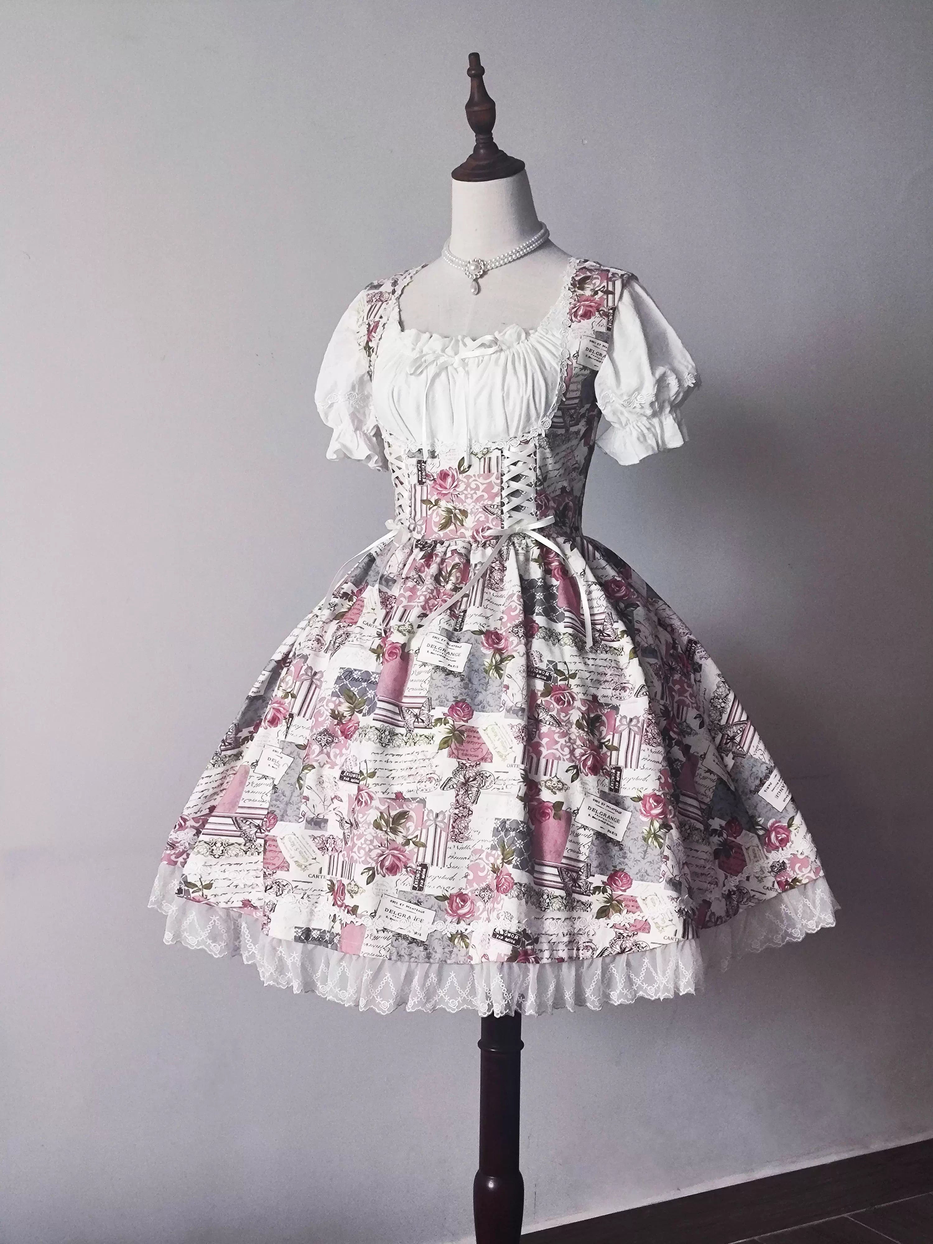 Design Concept:
This Sweet Lolita JSK dress features a delicate floral print with lace-trimmed hems and a vintage bustier-style bodice, combining playful charm with refined elegance. The A-line silhouette and soft, breathable fabric create a graceful, comfortable fit, perfect for daily wear, tea parties, or casual Lolita gatherings. Its timeless floral pattern and lace detailing add a sweet, feminine touch to any Lolita ensemble.