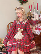 Inspired by festive nostalgia and childhood charm, this dress blends classic Christmas colors with a playful doll collar and soft plaid fabric. The A-line silhouette and delicate details evoke a storybook sweetness, while the cozy construction ensures comfort for holiday gatherings. A delightful piece that captures the magic of the season with timeless innocence and warmth.