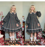 Inspired by festive nostalgia and childhood charm, this dress blends classic Christmas colors with a playful doll collar and soft plaid fabric. The A-line silhouette and delicate details evoke a storybook sweetness, while the cozy construction ensures comfort for holiday gatherings. A delightful piece that captures the magic of the season with timeless innocence and warmth.