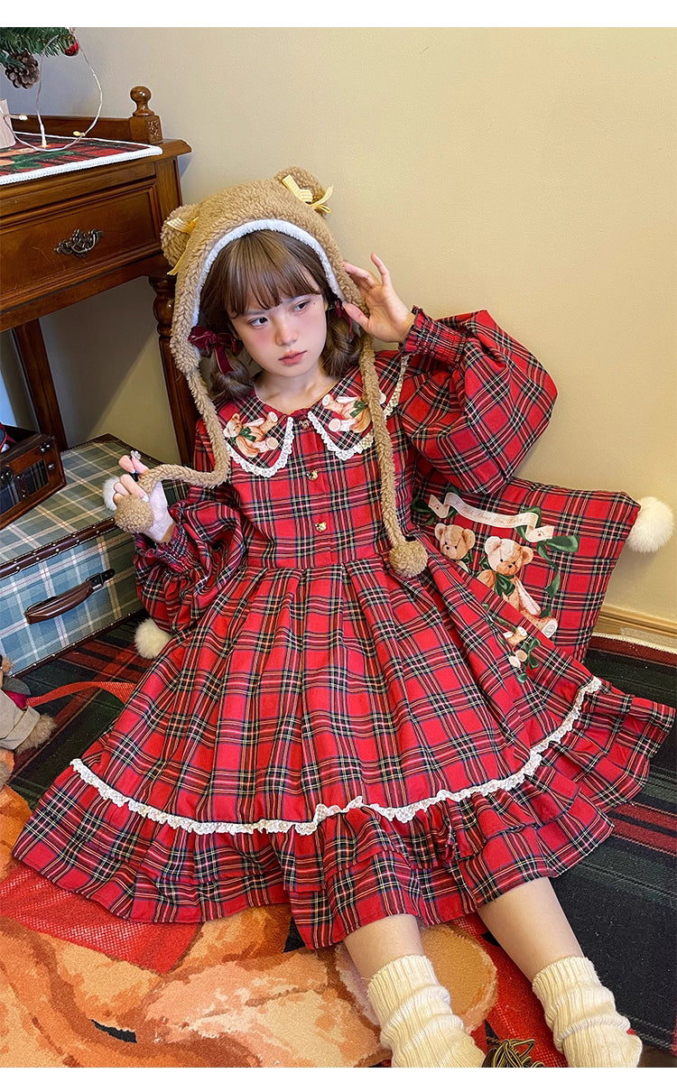Inspired by festive nostalgia and childhood charm, this dress blends classic Christmas colors with a playful doll collar and soft plaid fabric. The A-line silhouette and delicate details evoke a storybook sweetness, while the cozy construction ensures comfort for holiday gatherings. A delightful piece that captures the magic of the season with timeless innocence and warmth.