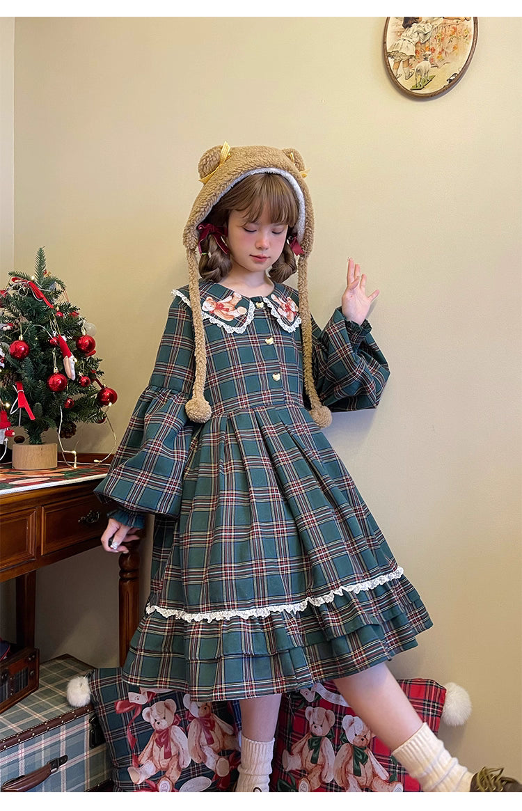 Inspired by festive nostalgia and childhood charm, this dress blends classic Christmas colors with a playful doll collar and soft plaid fabric. The A-line silhouette and delicate details evoke a storybook sweetness, while the cozy construction ensures comfort for holiday gatherings. A delightful piece that captures the magic of the season with timeless innocence and warmth.