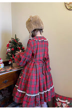 Inspired by festive nostalgia and childhood charm, this dress blends classic Christmas colors with a playful doll collar and soft plaid fabric. The A-line silhouette and delicate details evoke a storybook sweetness, while the cozy construction ensures comfort for holiday gatherings. A delightful piece that captures the magic of the season with timeless innocence and warmth.