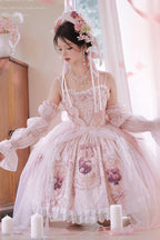 Inspired by a blooming garden at dawn, this JSK captures the delicate balance between youthful sweetness and refined grace. Soft floral prints dance across layers of lace and ruffles, while satin bows and intricate embroidery add a touch of royal fantasy. Designed to evoke the romance of a fairy tale, it invites the wearer to embrace both playful charm and timeless elegance—where every detail whispers a story of beauty and dreams.