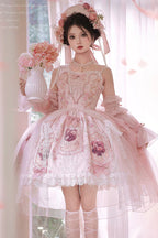 Inspired by a blooming garden at dawn, this JSK captures the delicate balance between youthful sweetness and refined grace. Soft floral prints dance across layers of lace and ruffles, while satin bows and intricate embroidery add a touch of royal fantasy. Designed to evoke the romance of a fairy tale, it invites the wearer to embrace both playful charm and timeless elegance—where every detail whispers a story of beauty and dreams.