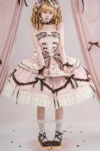 This Pink Sleeveless Sweet Lolita JSK Dress blends youthful sweetness with graceful elegance. Adorned with delicate prints, layered ruffles, and charming bowknot accents, it creates a soft and romantic aesthetic. The lace-up design ensures a flattering fit while enhancing the princess-like silhouette. Crafted in a dreamy pink tone, this dress is perfect for tea parties, gatherings, or photoshoots, offering a timeless Lolita charm that balances playful cuteness with refined sophistication.