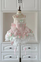 This Pink Sleeveless Sweet Lolita JSK Dress radiates a dreamy princess-like charm. Featuring delicate embroidery, lace trims, and pearl accents, it captures a sense of refined elegance. The ruffle details and bowknots add playful sweetness, while the soft pink tone enhances its romantic allure. Designed with a flattering silhouette, it is perfect for tea parties, photoshoots, or special gatherings. A versatile piece that blends classic Lolita beauty with graceful, feminine sophistication.