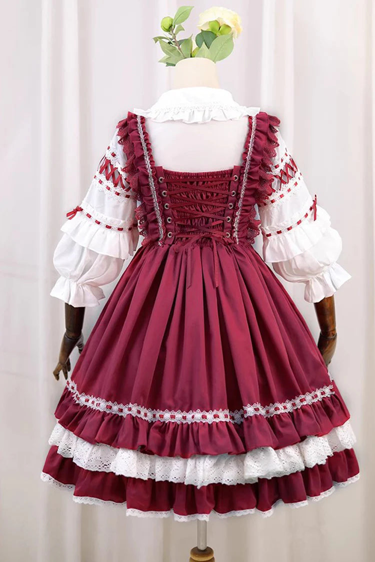 This Red White Sweet Lolita JSK Dress features a charming sleeveless design paired with a delicate cardigan for versatile layering. Multi layered ruffles and lace trims create a soft voluminous silhouette while bowknot details enhance its playful sweetness. The bold red and pure white contrast offers a festive yet elegant look making it perfect for tea parties holiday gatherings or themed occasions. Designed for comfort and style this set captures the essence of youthful Lolita fashion with timeless charm.