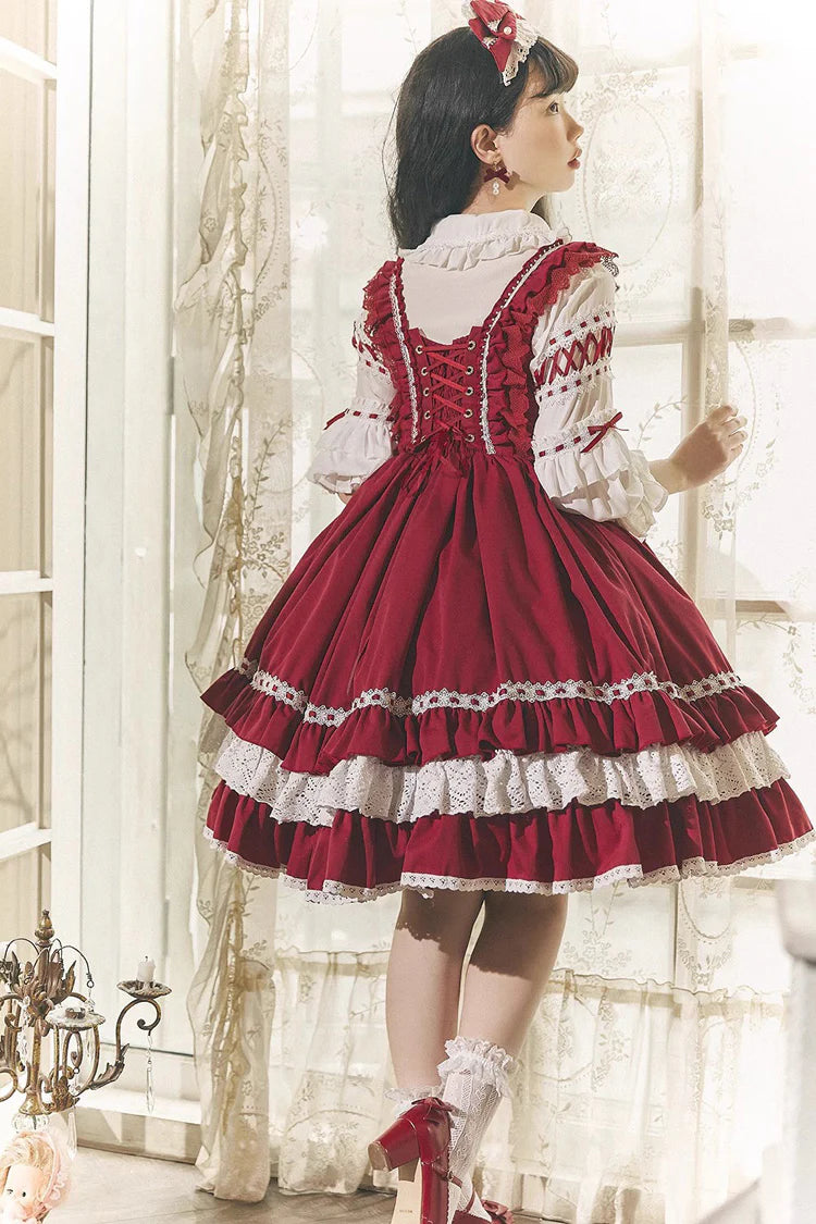 This Red White Sweet Lolita JSK Dress features a charming sleeveless design paired with a delicate cardigan for versatile layering. Multi layered ruffles and lace trims create a soft voluminous silhouette while bowknot details enhance its playful sweetness. The bold red and pure white contrast offers a festive yet elegant look making it perfect for tea parties holiday gatherings or themed occasions. Designed for comfort and style this set captures the essence of youthful Lolita fashion with timeless charm.