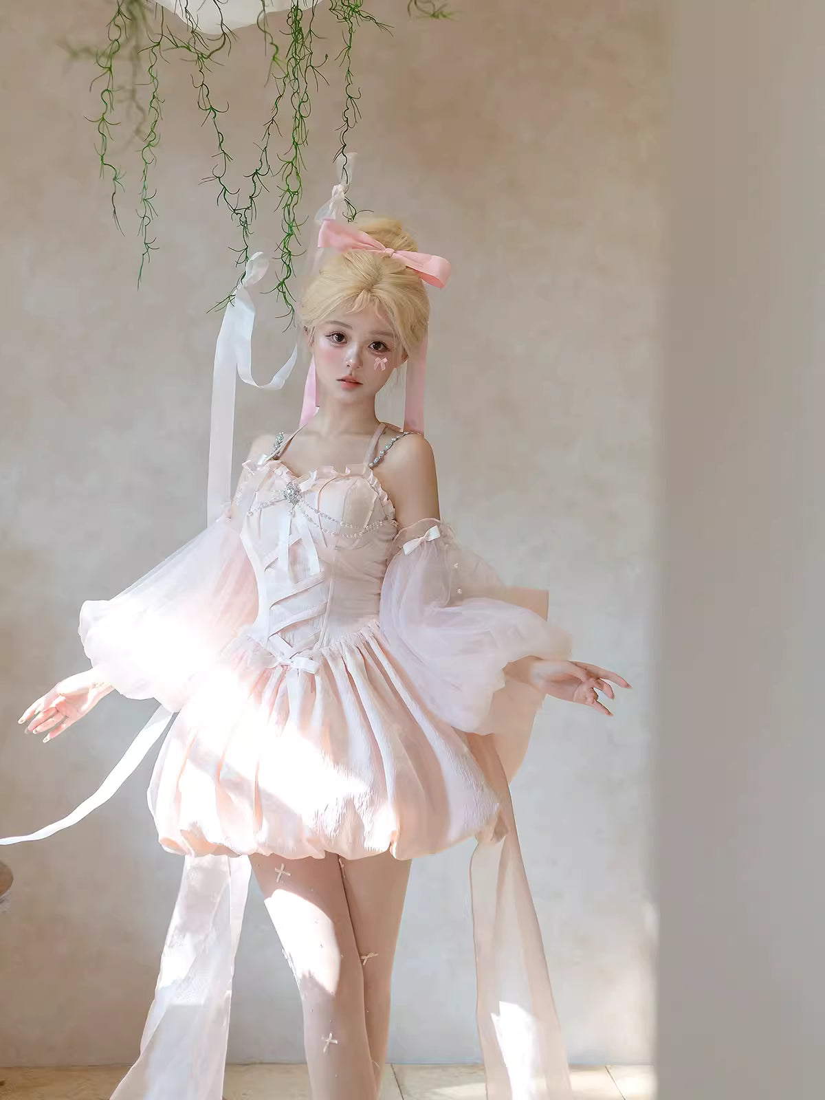 Inspired by fairy-tale escapism, this Lolita dress features a delicate floral print, a structured bustier, and a soft bloom-shaped skirt. The sweet pink palette and intricate lace details evoke romantic fantasy, while the lightweight fabric ensures comfort. Perfect for creating dreamy, whimsical moments.