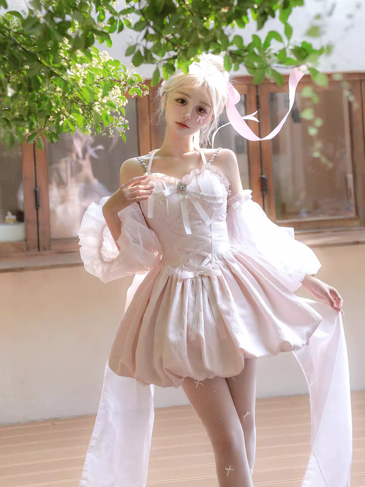 Inspired by fairy-tale escapism, this Lolita dress features a delicate floral print, a structured bustier, and a soft bloom-shaped skirt. The sweet pink palette and intricate lace details evoke romantic fantasy, while the lightweight fabric ensures comfort. Perfect for creating dreamy, whimsical moments.