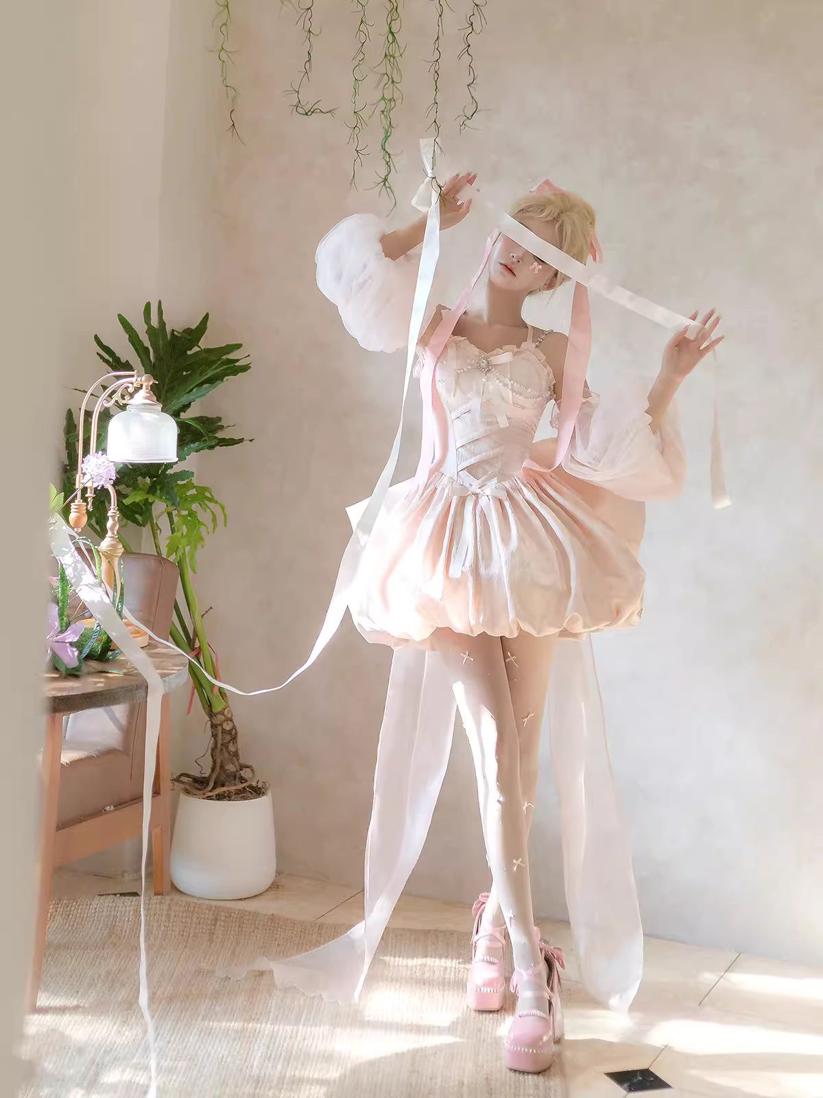 Inspired by fairy-tale escapism, this Lolita dress features a delicate floral print, a structured bustier, and a soft bloom-shaped skirt. The sweet pink palette and intricate lace details evoke romantic fantasy, while the lightweight fabric ensures comfort. Perfect for creating dreamy, whimsical moments.