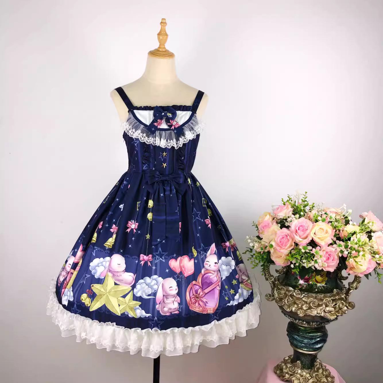 Inspired by a celestial carnival, this "Star Paradise" JSK features vibrant red printed fabric and playful bow accents. The strapless design and A-line silhouette offer a flattering fit for daily wear. Sweet yet versatile, it combines whimsical charm with wearable elegance, perfect for creating joyful coordinates that capture the magic of a starlit fantasy.
