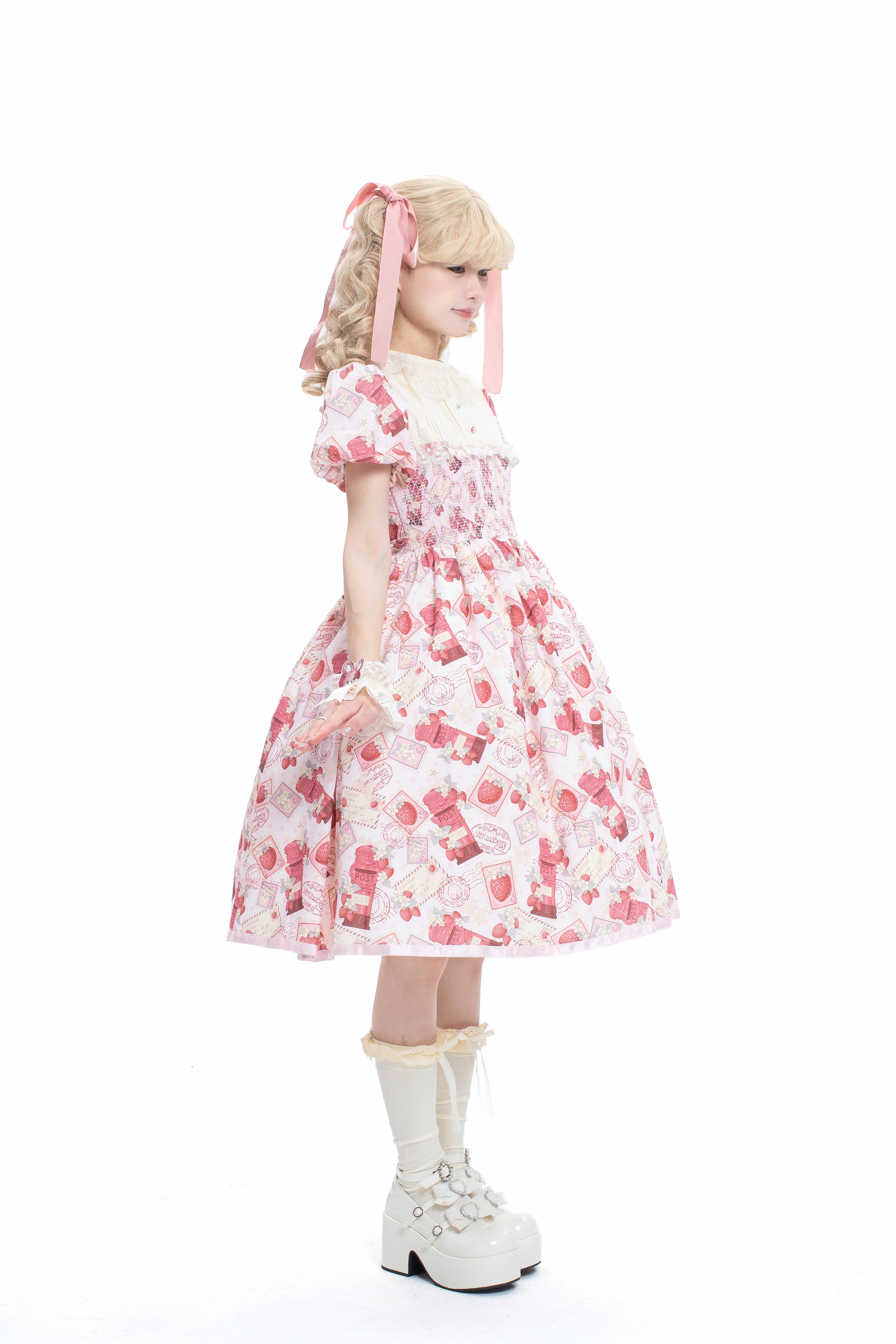 Enchanted by rustic witchcraft and sweet folklore, this pink dress blooms with delicate strawberry embroidery and whimsical prints. The sleeveless design and lightweight cotton ensure cool comfort for summer, while layered ruffles and a fitted waist balance playful charm with elegant structure. A spellbinding piece that captures the magic of sun-ripened berries and pastoral daydreams.