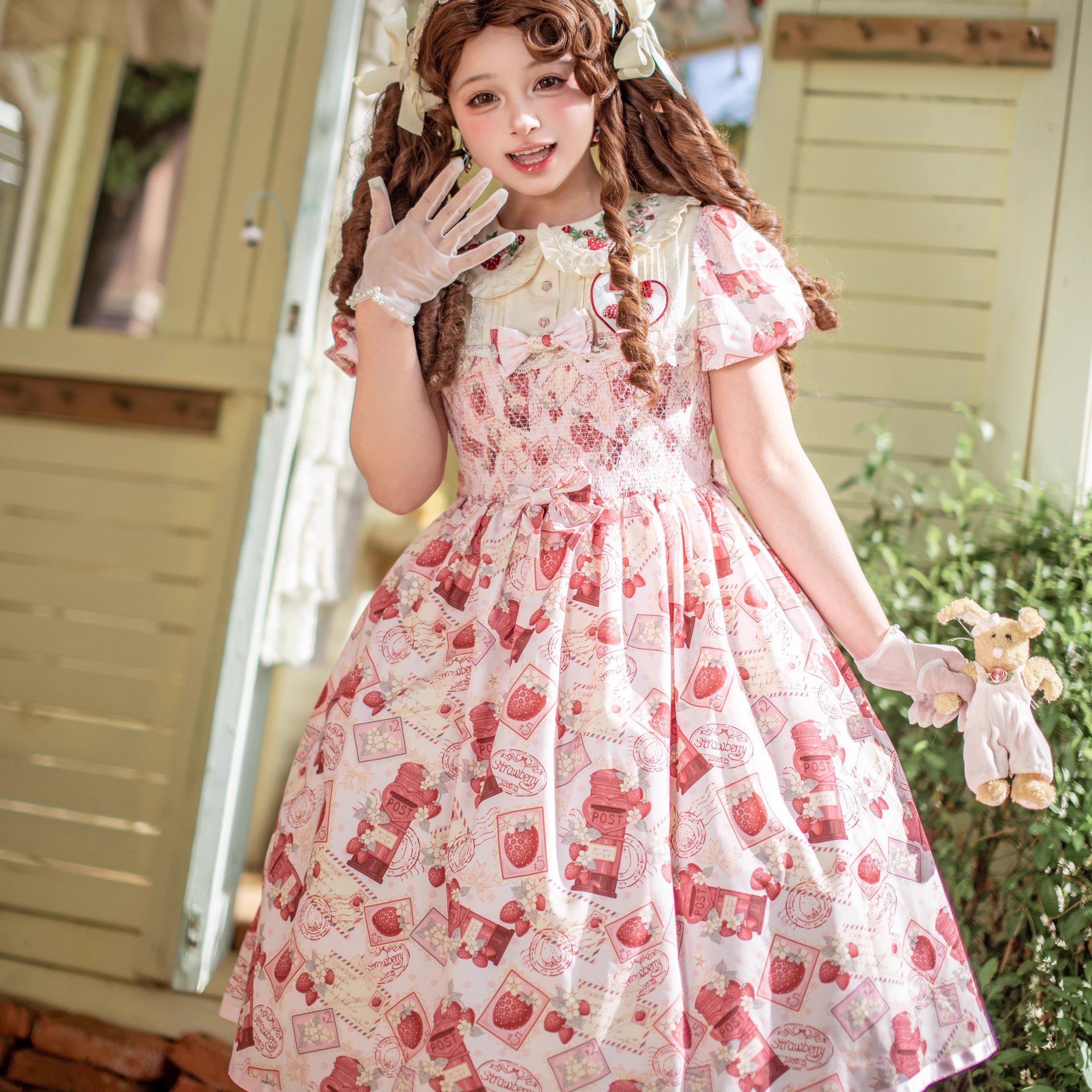 Enchanted by rustic witchcraft and sweet folklore, this pink dress blooms with delicate strawberry embroidery and whimsical prints. The sleeveless design and lightweight cotton ensure cool comfort for summer, while layered ruffles and a fitted waist balance playful charm with elegant structure. A spellbinding piece that captures the magic of sun-ripened berries and pastoral daydreams.
