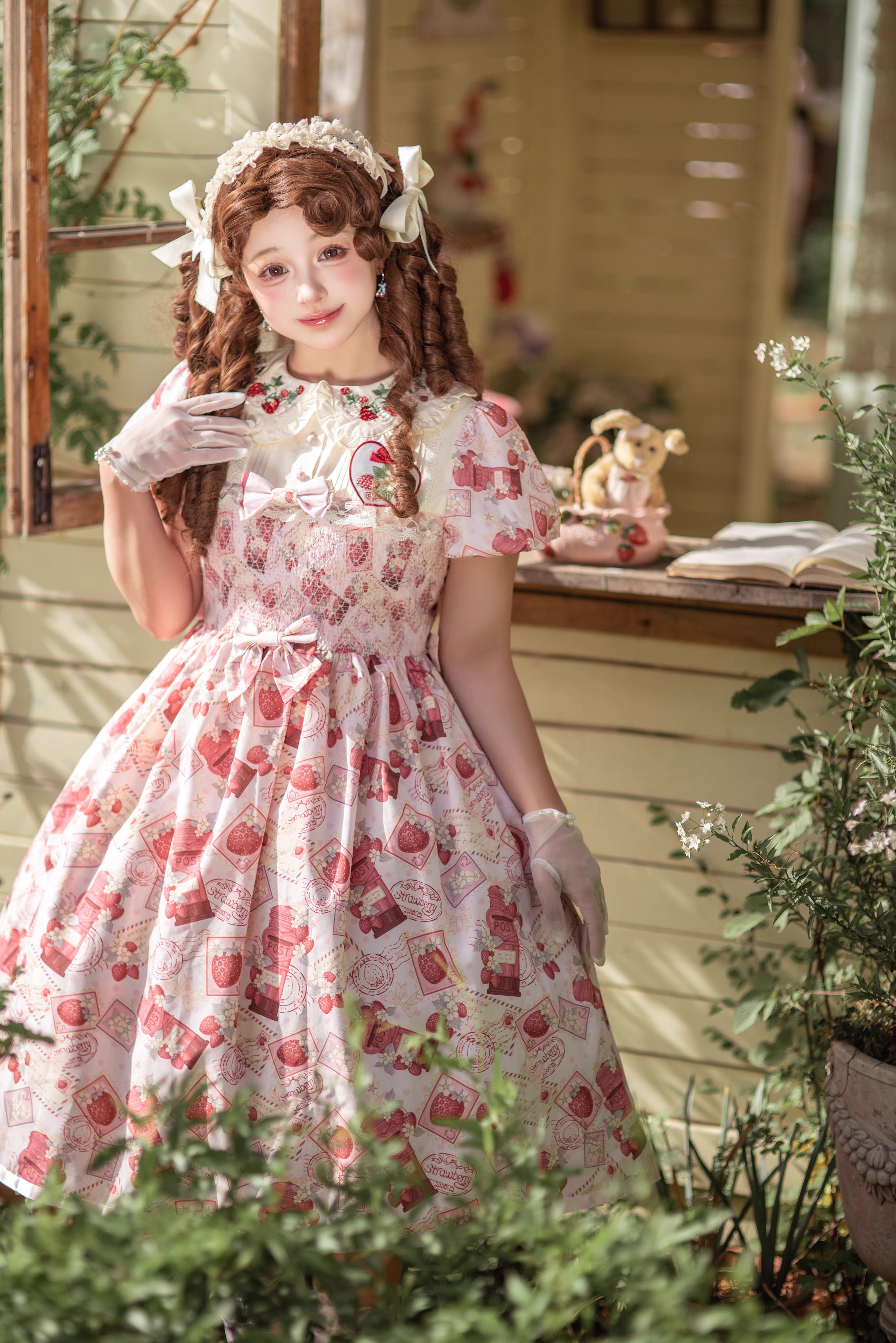 Enchanted by rustic witchcraft and sweet folklore, this pink dress blooms with delicate strawberry embroidery and whimsical prints. The sleeveless design and lightweight cotton ensure cool comfort for summer, while layered ruffles and a fitted waist balance playful charm with elegant structure. A spellbinding piece that captures the magic of sun-ripened berries and pastoral daydreams.