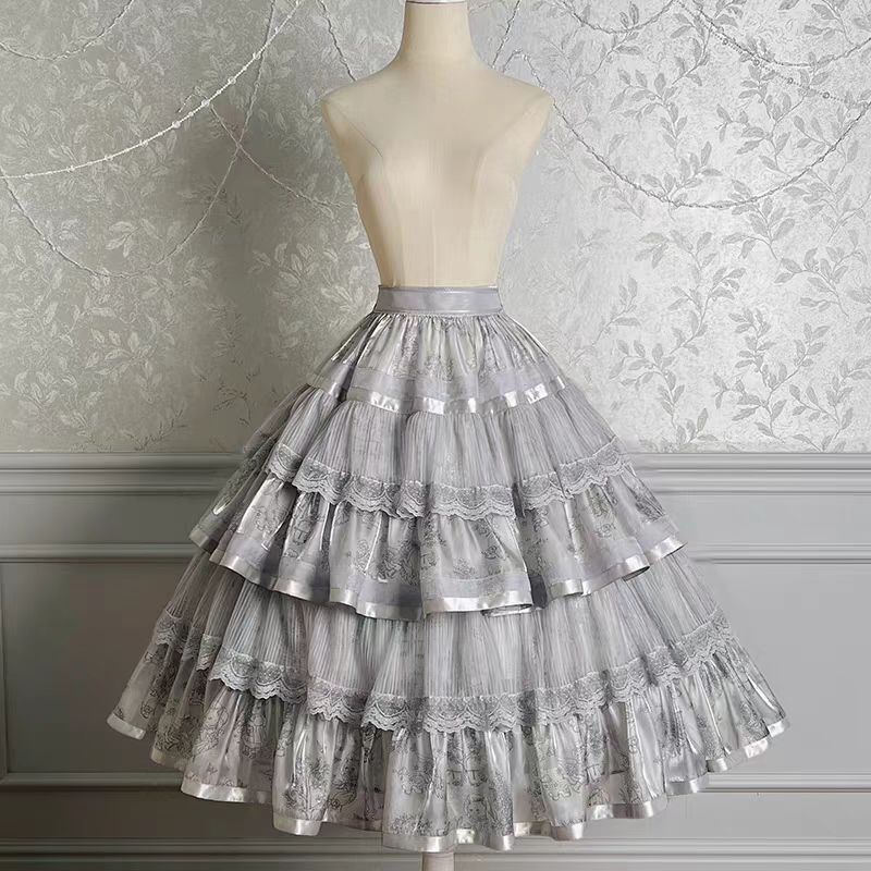 Enter a realm of opulent fantasy with the Twin Bears Gilded Dream skirt, where artistry meets elegance. This original design features exquisite golden embroidery shimmering against a luxurious fabric backdrop, evoking the magic of a twilight dream. The A-line silhouette flows gracefully, adorned with intricate details that catch the light with every movement. Perfect for enchanting tea parties, romantic gatherings, or adding a touch of grandeur to daily wear. Each stitch tells a story of craftsmanship and w