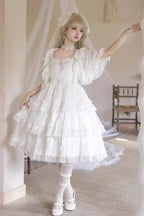 The Wedding Lolita White Starry Romance JSK Dress is created to blend bridal elegance with the dreamy sweetness of Lolita fashion. Crafted in pure white, it features multi-layered ruffles, graceful bow accents, and subtle starry details that evoke a fairytale atmosphere. The princess silhouette conveys both purity and sophistication, making it perfect for special ceremonies, photoshoots, or romantic occasions. Designed to capture timeless beauty, it offers a harmonious balance of sweetness, refinement, and 
