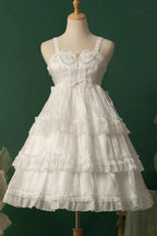 The Wedding Lolita White Starry Romance JSK Dress is created to blend bridal elegance with the dreamy sweetness of Lolita fashion. Crafted in pure white, it features multi-layered ruffles, graceful bow accents, and subtle starry details that evoke a fairytale atmosphere. The princess silhouette conveys both purity and sophistication, making it perfect for special ceremonies, photoshoots, or romantic occasions. Designed to capture timeless beauty, it offers a harmonious balance of sweetness, refinement, and 