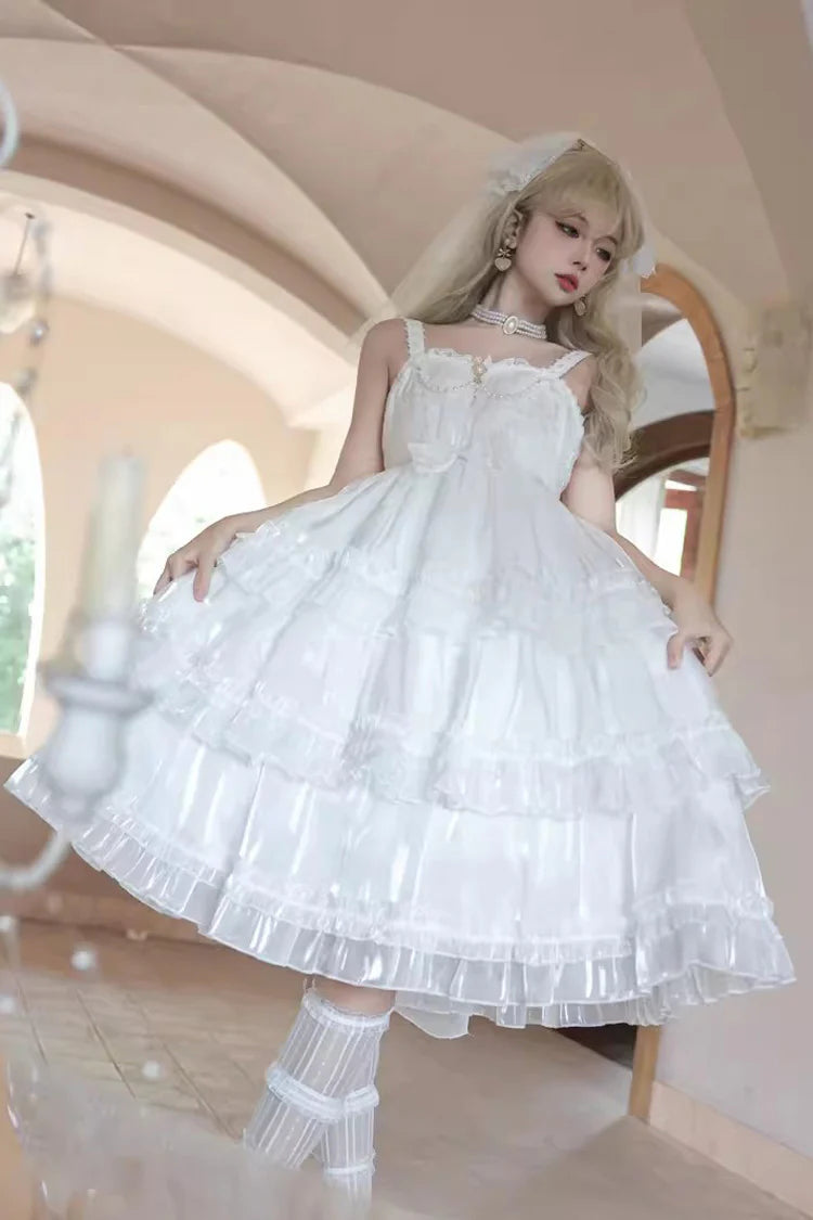 The Wedding Lolita White Starry Romance JSK Dress is created to blend bridal elegance with the dreamy sweetness of Lolita fashion. Crafted in pure white, it features multi-layered ruffles, graceful bow accents, and subtle starry details that evoke a fairytale atmosphere. The princess silhouette conveys both purity and sophistication, making it perfect for special ceremonies, photoshoots, or romantic occasions. Designed to capture timeless beauty, it offers a harmonious balance of sweetness, refinement, and 