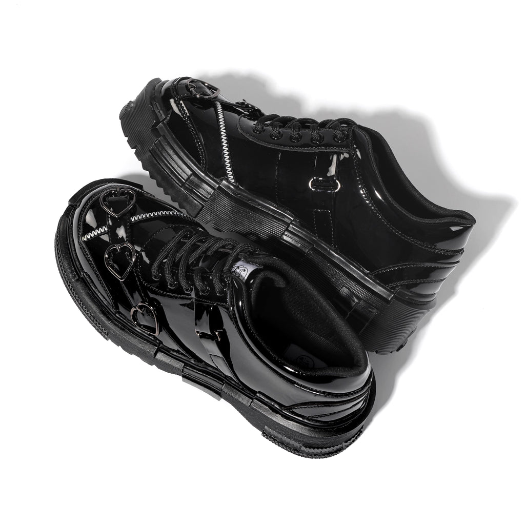 Black high-top sneakers with unique design on a white background
