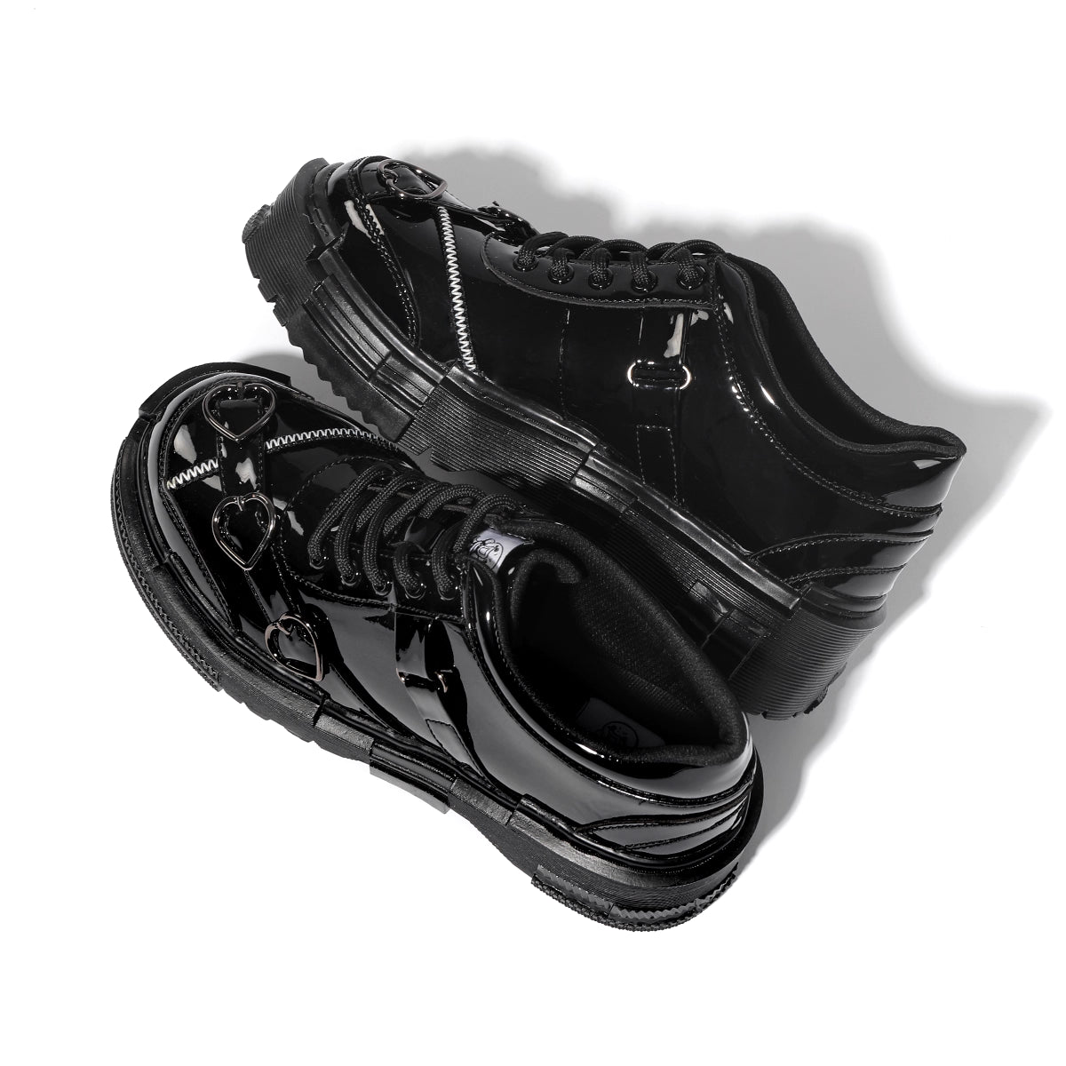 Black high-top sneakers with unique design on a white background