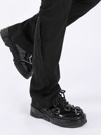 Black pants and black shoes on a white background