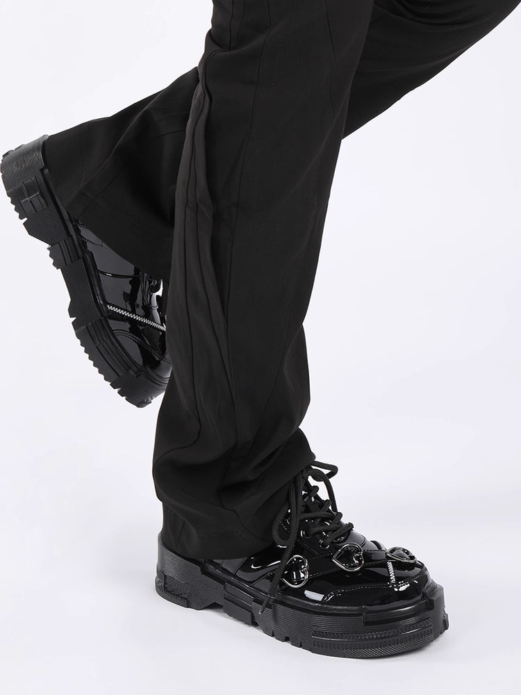 Black pants and black shoes on a white background