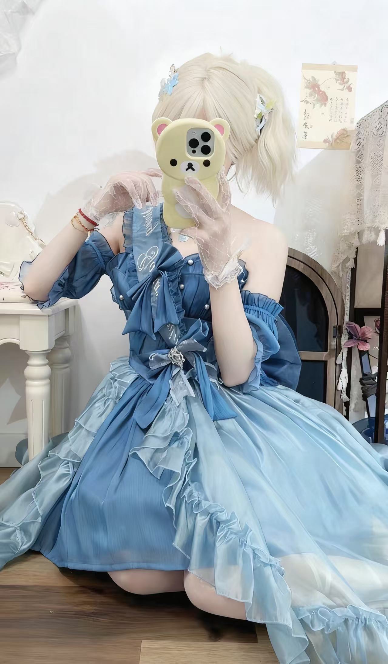Design Concept:

This Classic Lolita charming blue dress set features delicate lace trim and bow details, combining elegance with a cute and refined style. The soft blue tone adds a graceful touch, perfect for creating a timeless Lolita look. Product Details: The set includes a dress, matching wrist sleeves, and a ribbon sash, offering a coordinated ensemble that embodies classic Lolita charm.